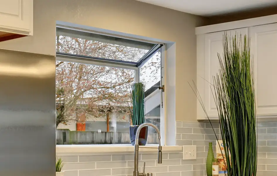 An internal view of a newly-installed garden window in a modern kitchen.