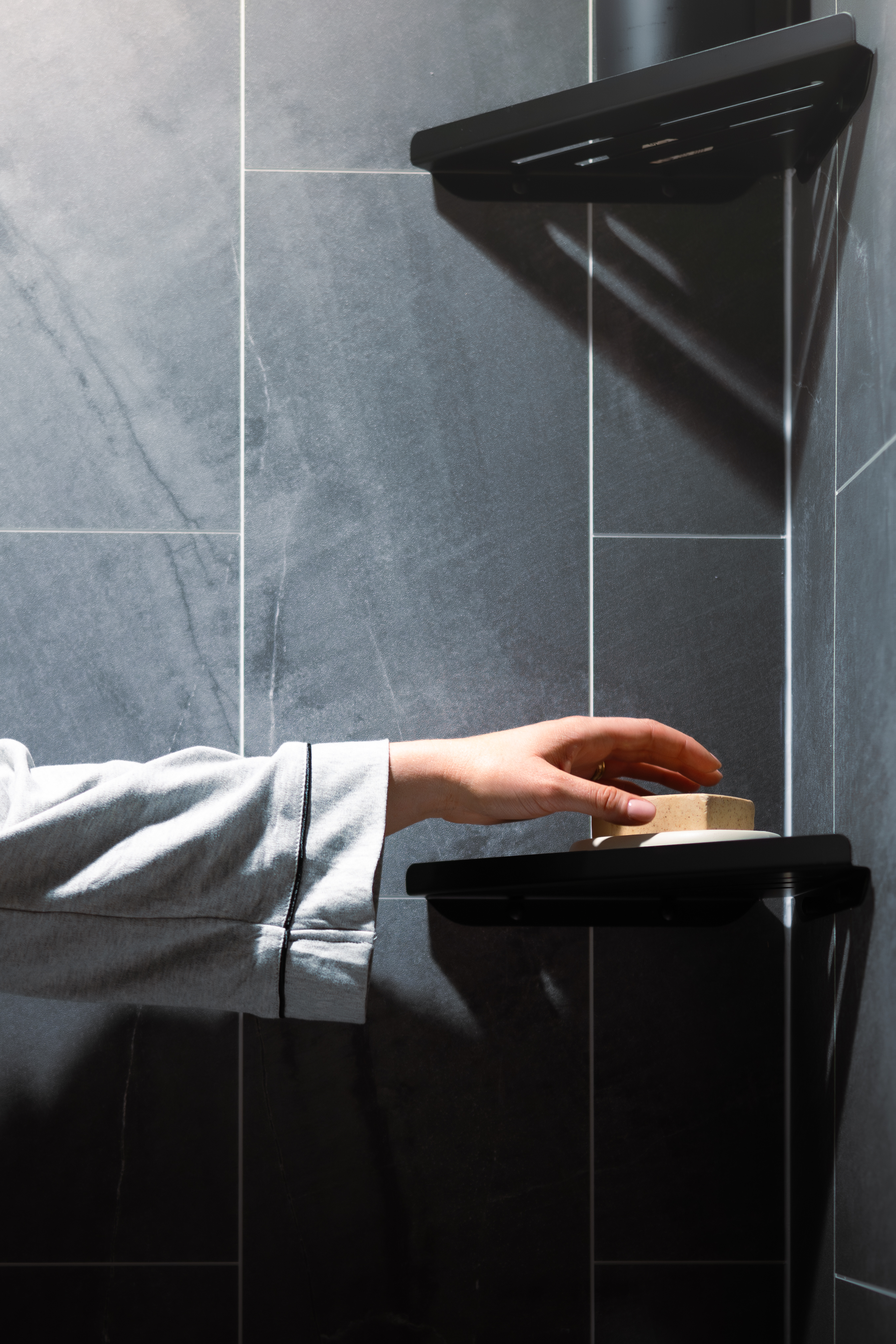Homeowner in their full luxury bathroom remodel