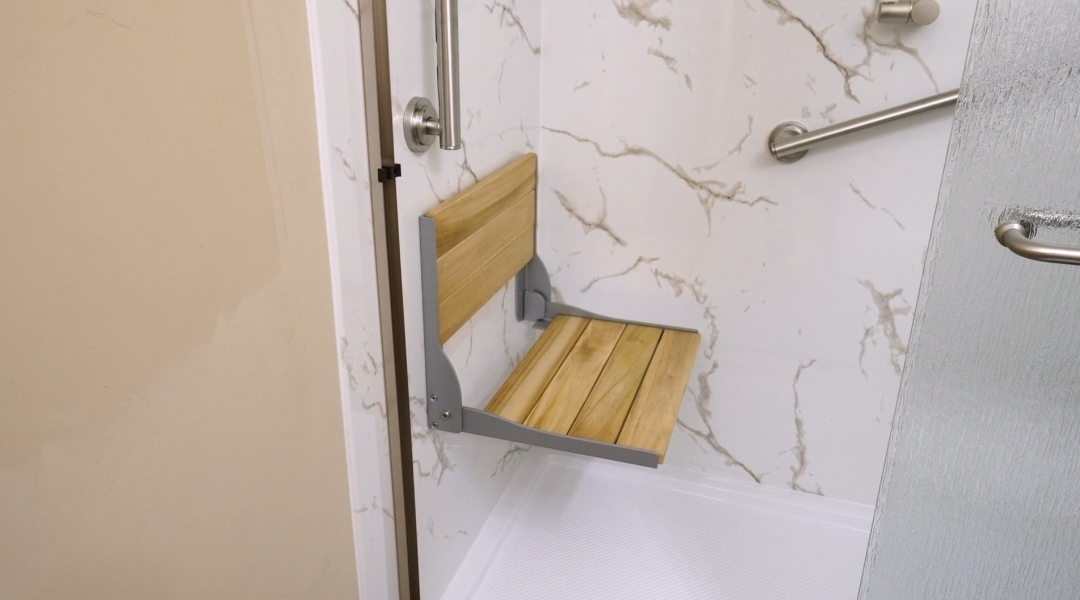 Light toned walk-in shower with seat