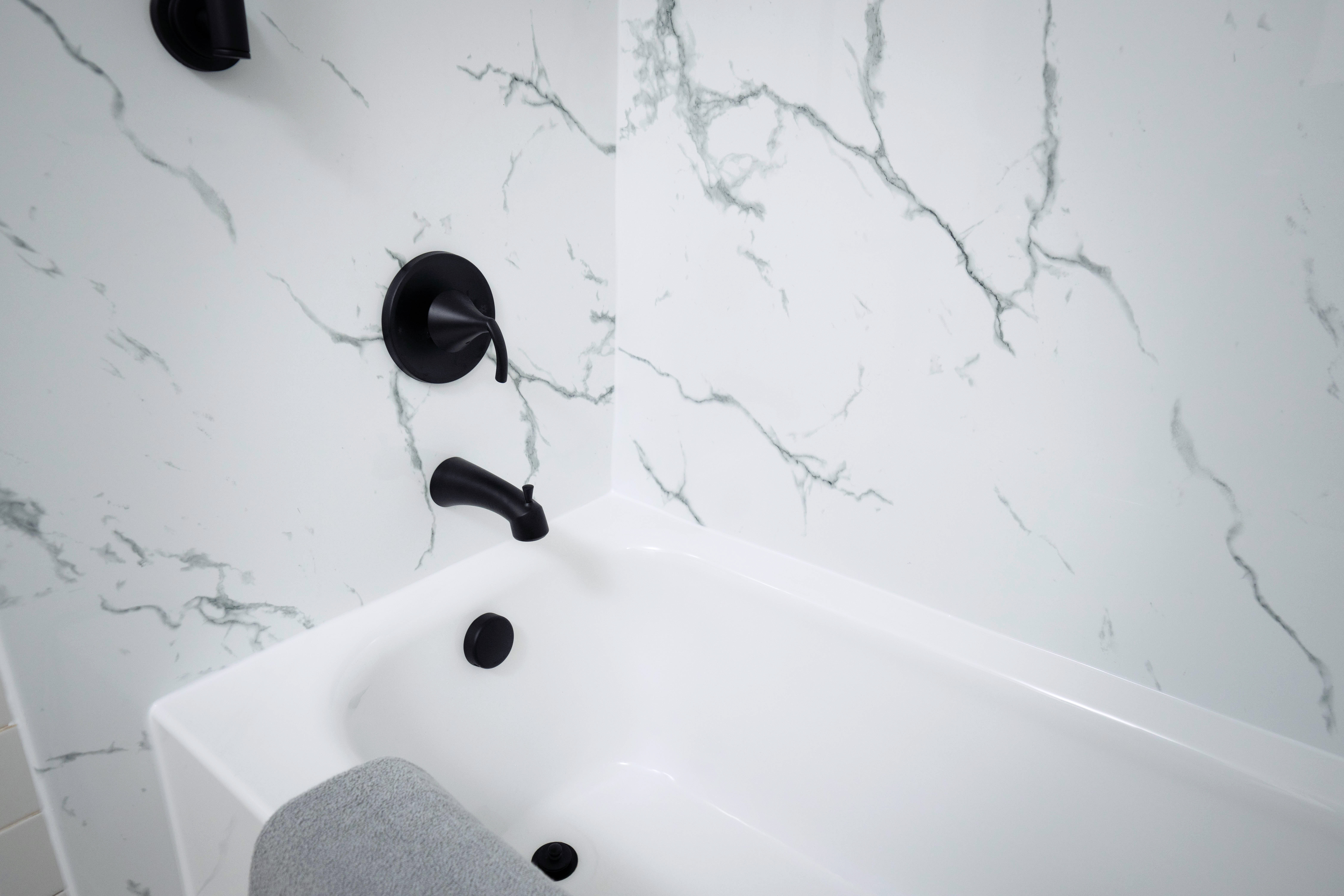 New bathtub with tile surround in Boston home