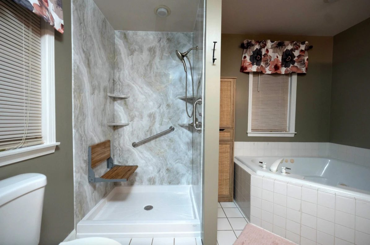 A newly-installed tub to shower conversion.