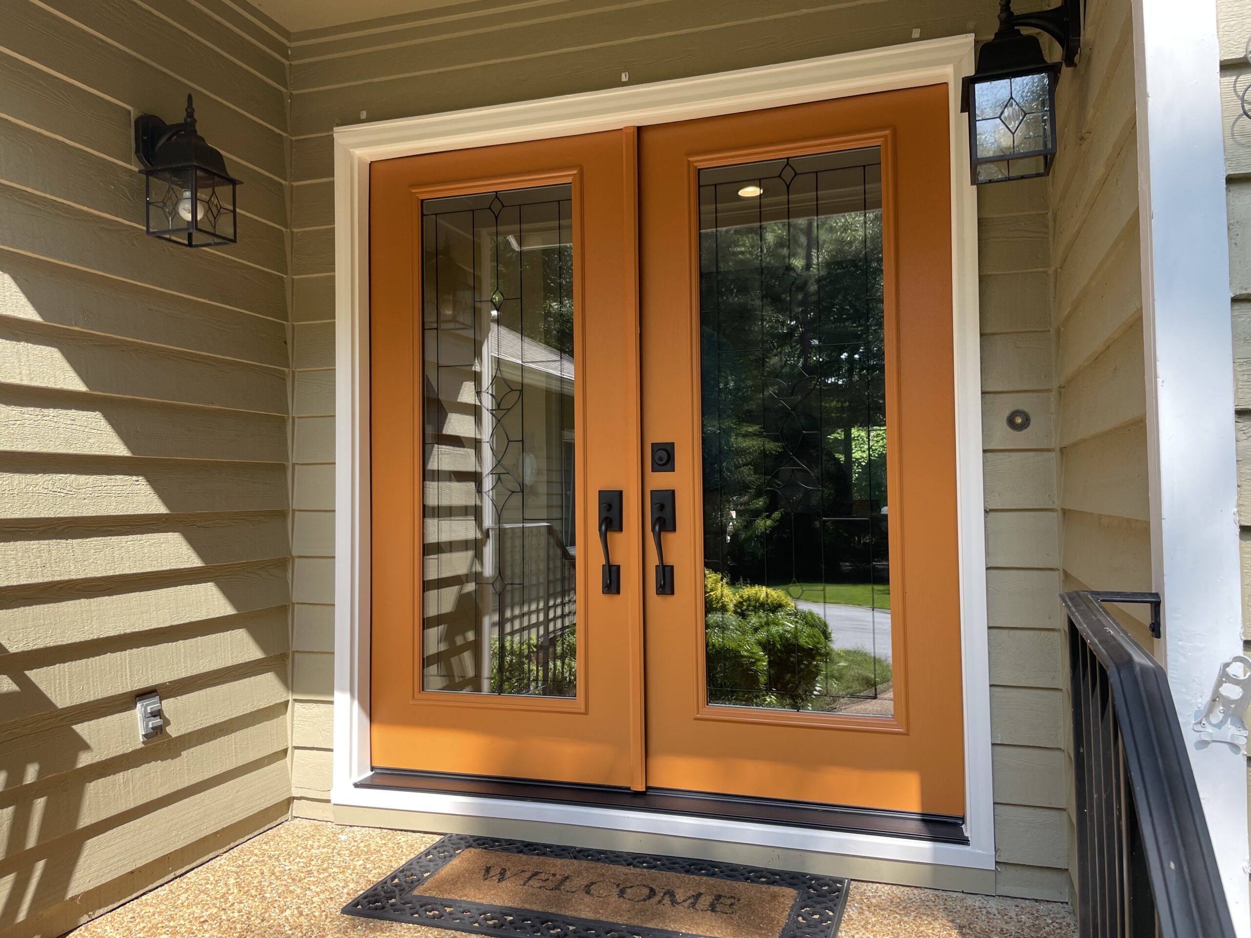 A bright orange French door installed on a home in Virginia.