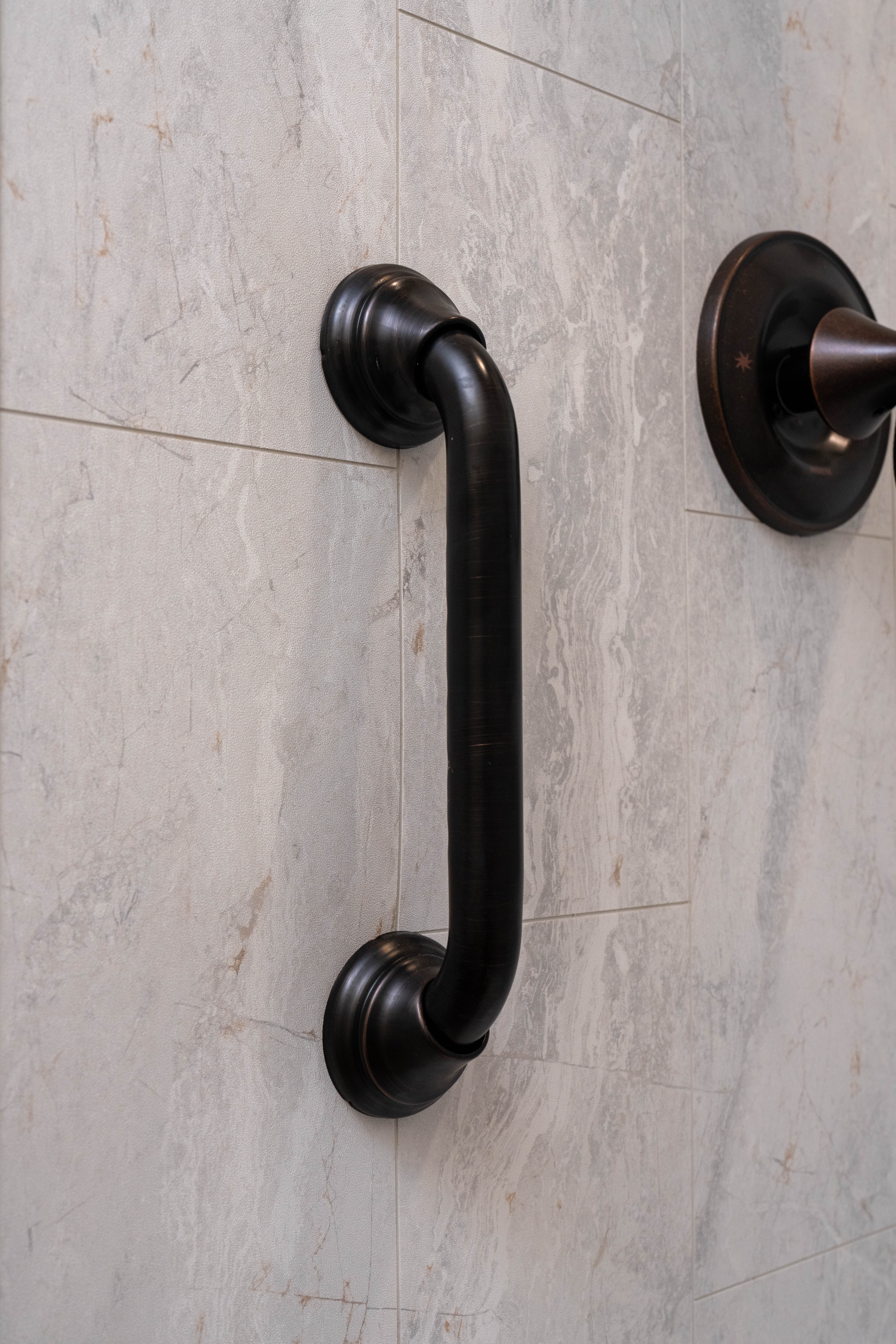 Homeowner in their full luxury bathroom remodel