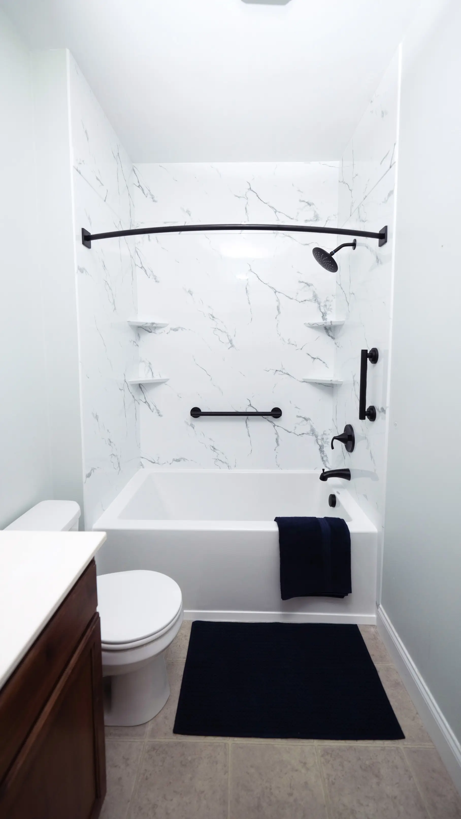 West Shore Home marble acrylic surround tub and shower combo install.