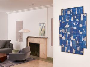 two artworks hung in a living room