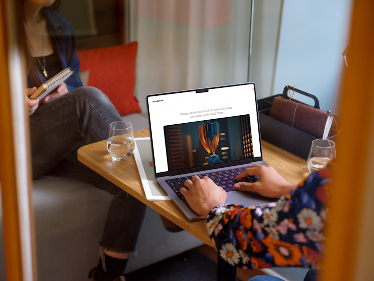 Image of laptop showing that Mindgruve is named fastest growing agency by Financial Times.