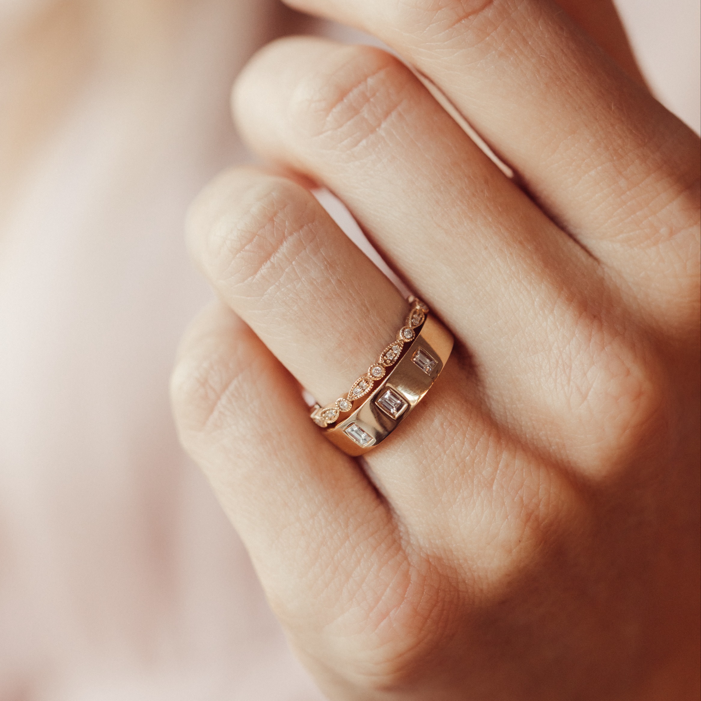 The Jaden Three Baguette Band with the Pear and Round Band on a models hand.
