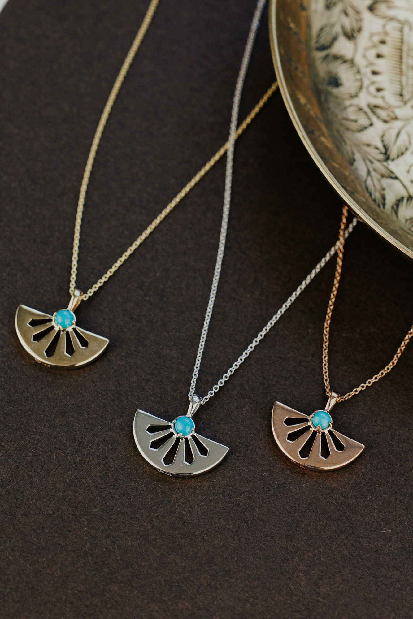 The Del Sol Necklace in three metal colors - yellow gold, white gold, and rose gold.