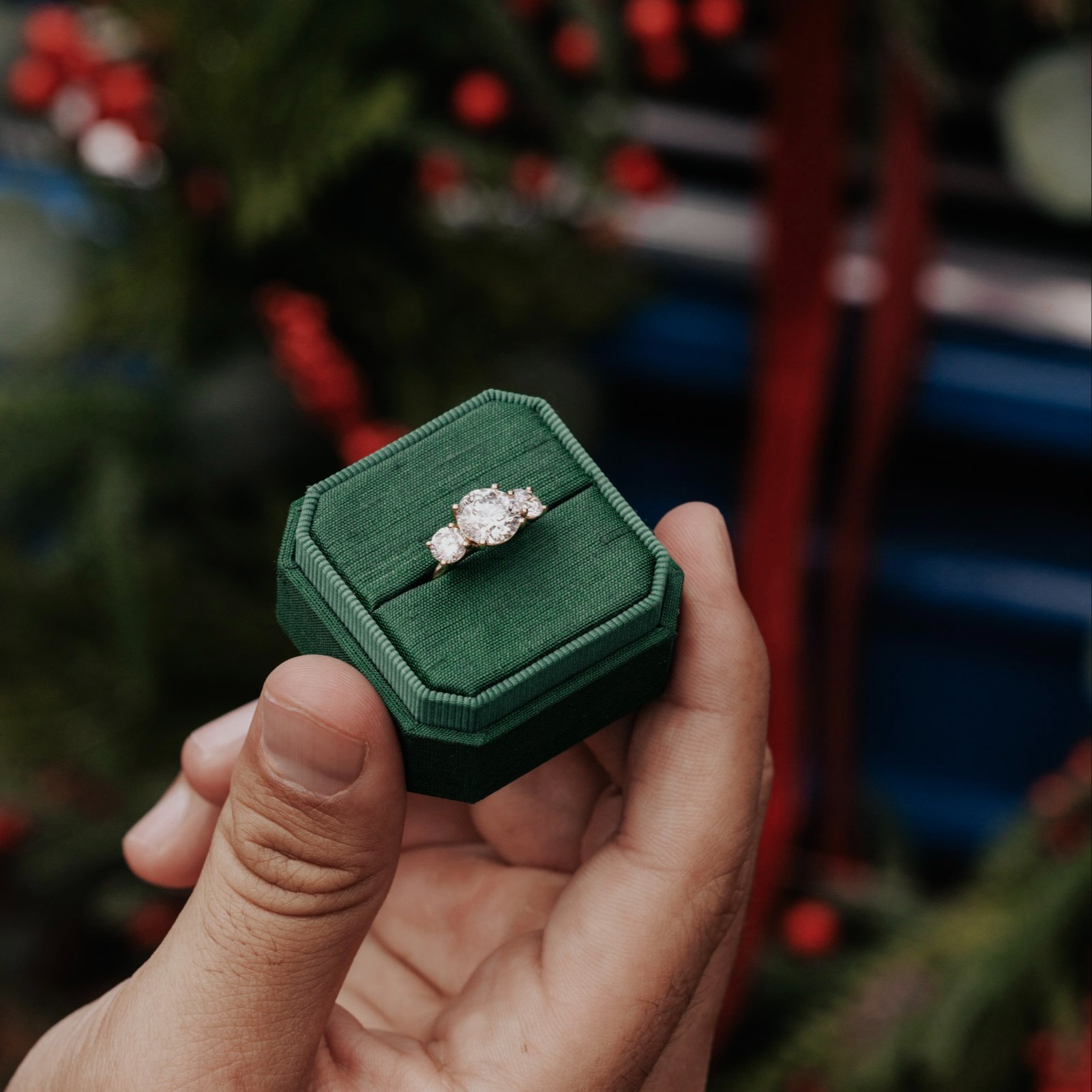 Diamond engagement ring in a green velvet ring box for the holidays.