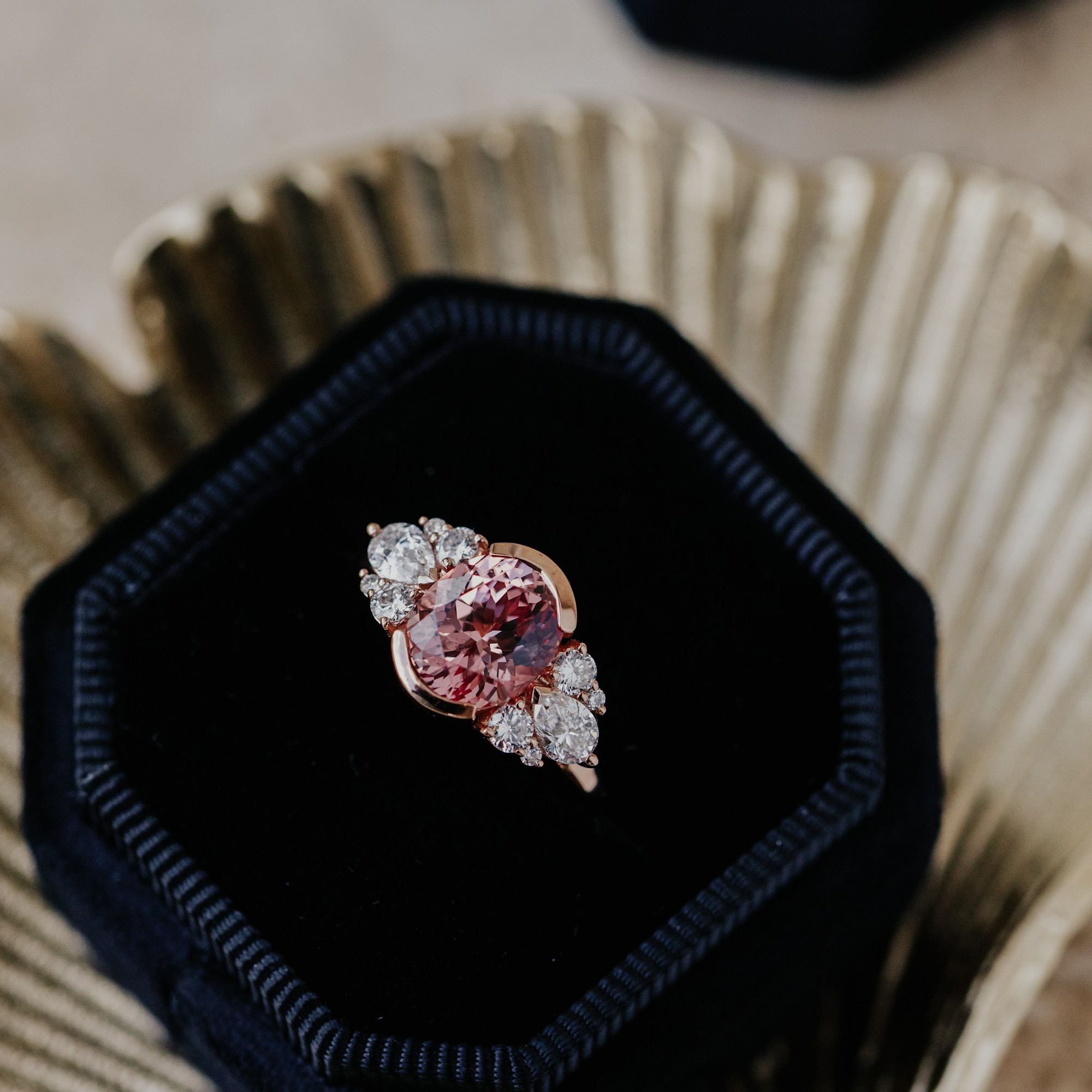 One of a kind ring featuring a oval garnet center stone set in our Rene design in a black velvet ring box