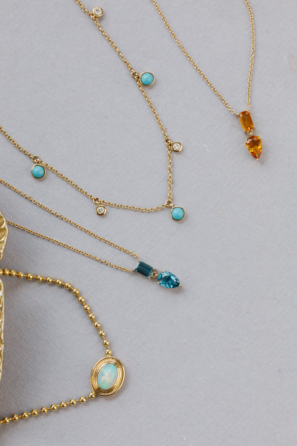 Gemstone necklaces from the gemstone edit on a white surface.