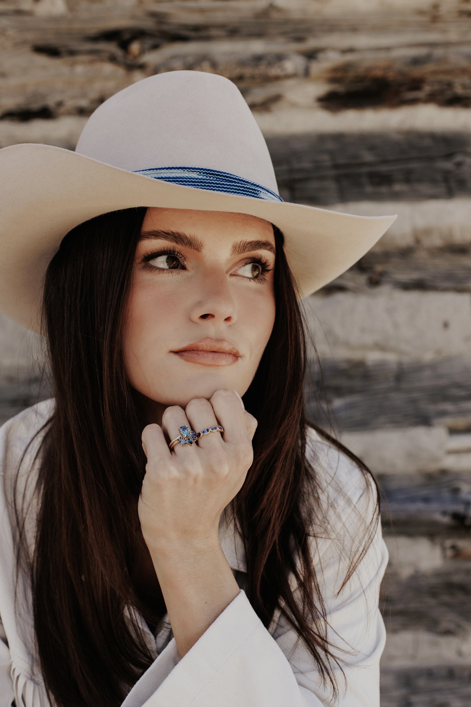 Woman wearing multiple Montana Sapphire Rings