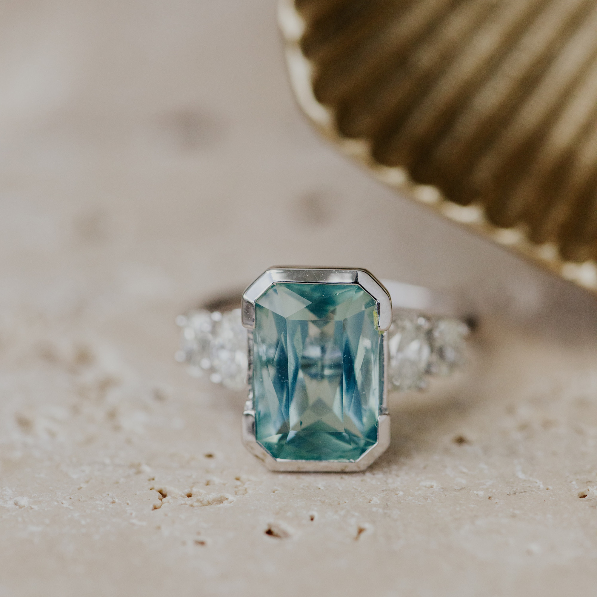 One of a kind ring featuring a emerald cut teal tourmaline center stone set in our Billie design.