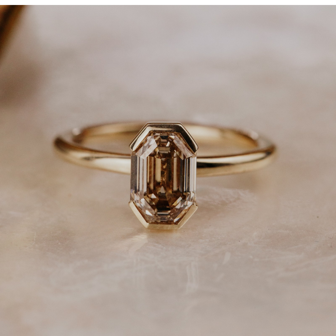 Zadie Octagon Champagne diamond on a white surface.