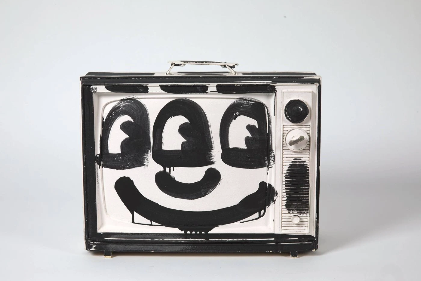Keith Haring, Untitled (black and white TV), 1986, acrylic paint on television, 20 in. x 28 in. x 14 in. Collection of Larry Warsh. © Keith Haring Foundation.