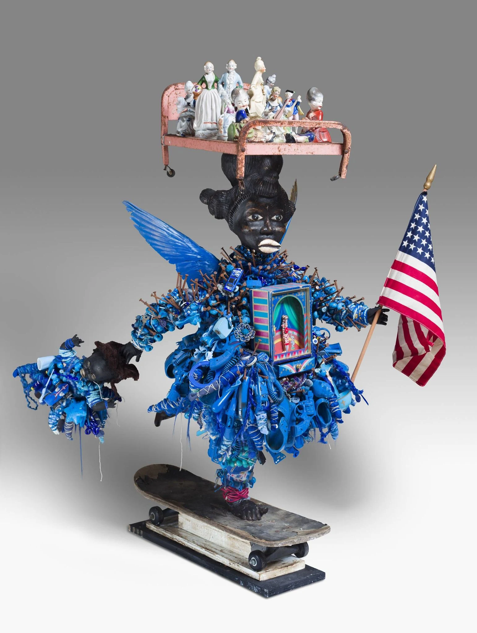 Vanessa German, Artist Considers the 21st Century Implications of Psychosis as Public Health Crisis or, Critical/Comedic Analysis into the Pathophysiology of Psychosis, 2014, mixed media assemblage, 40 in. x 55 in. x 26 in. Crystal Bridges Museum of American Art, Bentonville, Arkansas, 2020.92. Photography by Edward C. Robison III.