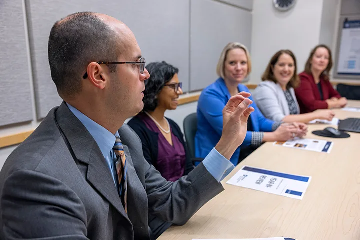 Implementation Science Associate Director with team