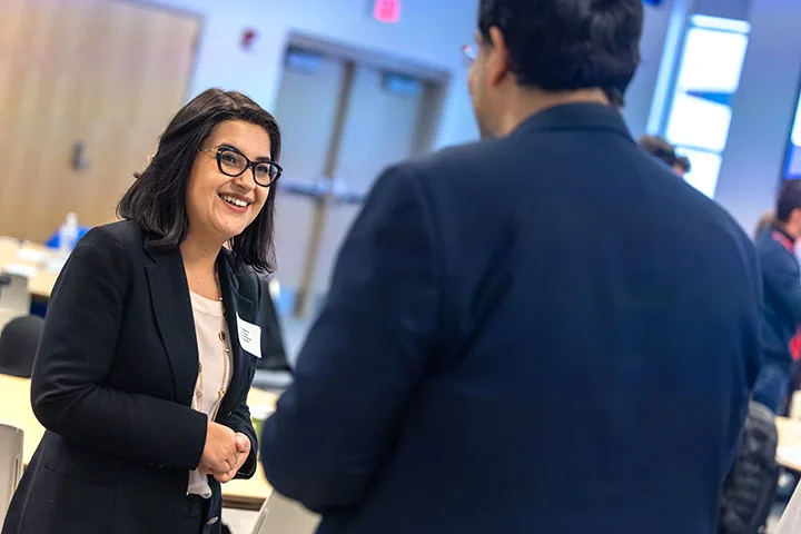Faculty connecting at an event