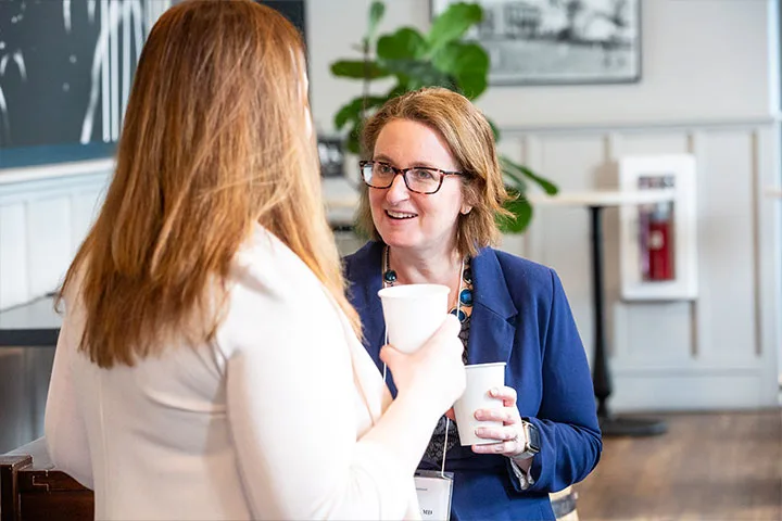 faculty talking to another researcher about qualitative mixed methods