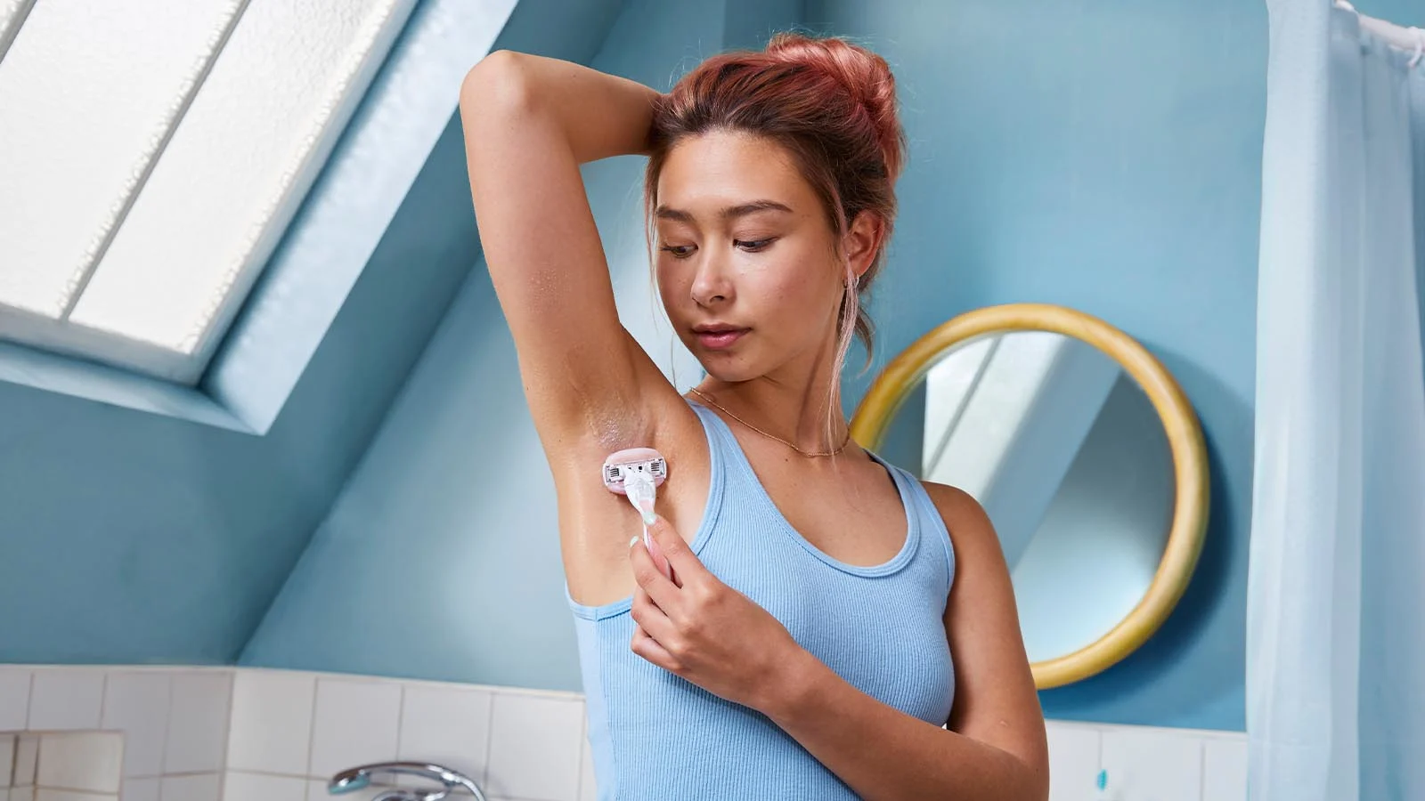 Woman Shaving Armpit Hair