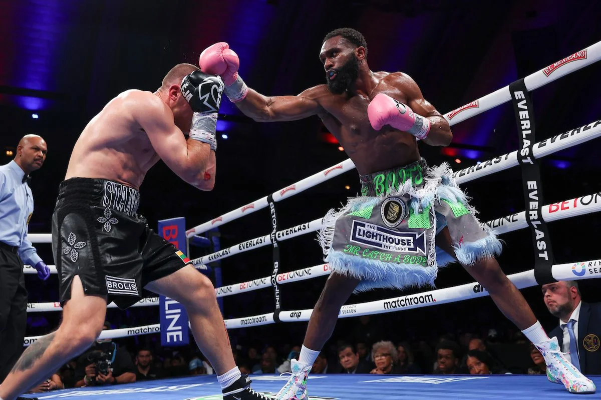 Jaron Boots Ennis punches Eimantas Stanionis in an earlier bout