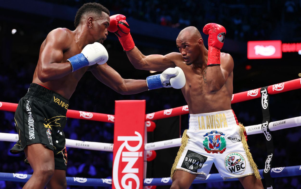 Alberto Puello exchanges punches with Subriel Matias in their earlier title contest