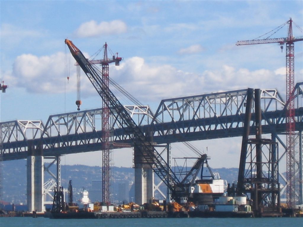 An enormous crane building a bridge