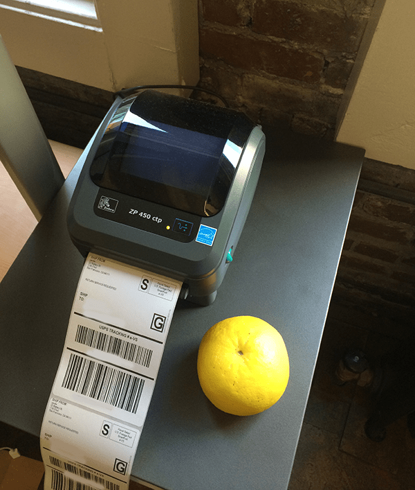 Zebra brand printer siting on a table