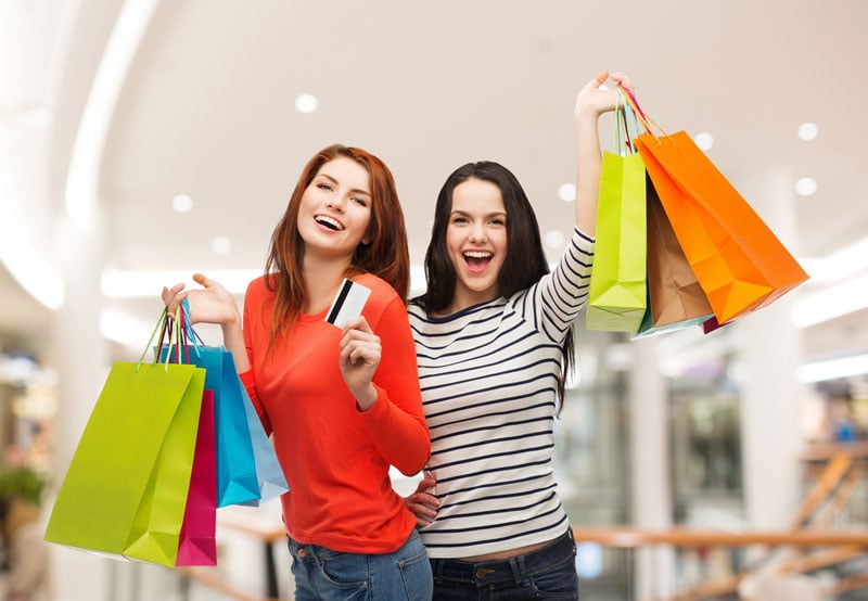 Happy women holding shopping bags