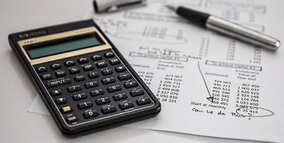 Calculator sitting on top of inventory sheet