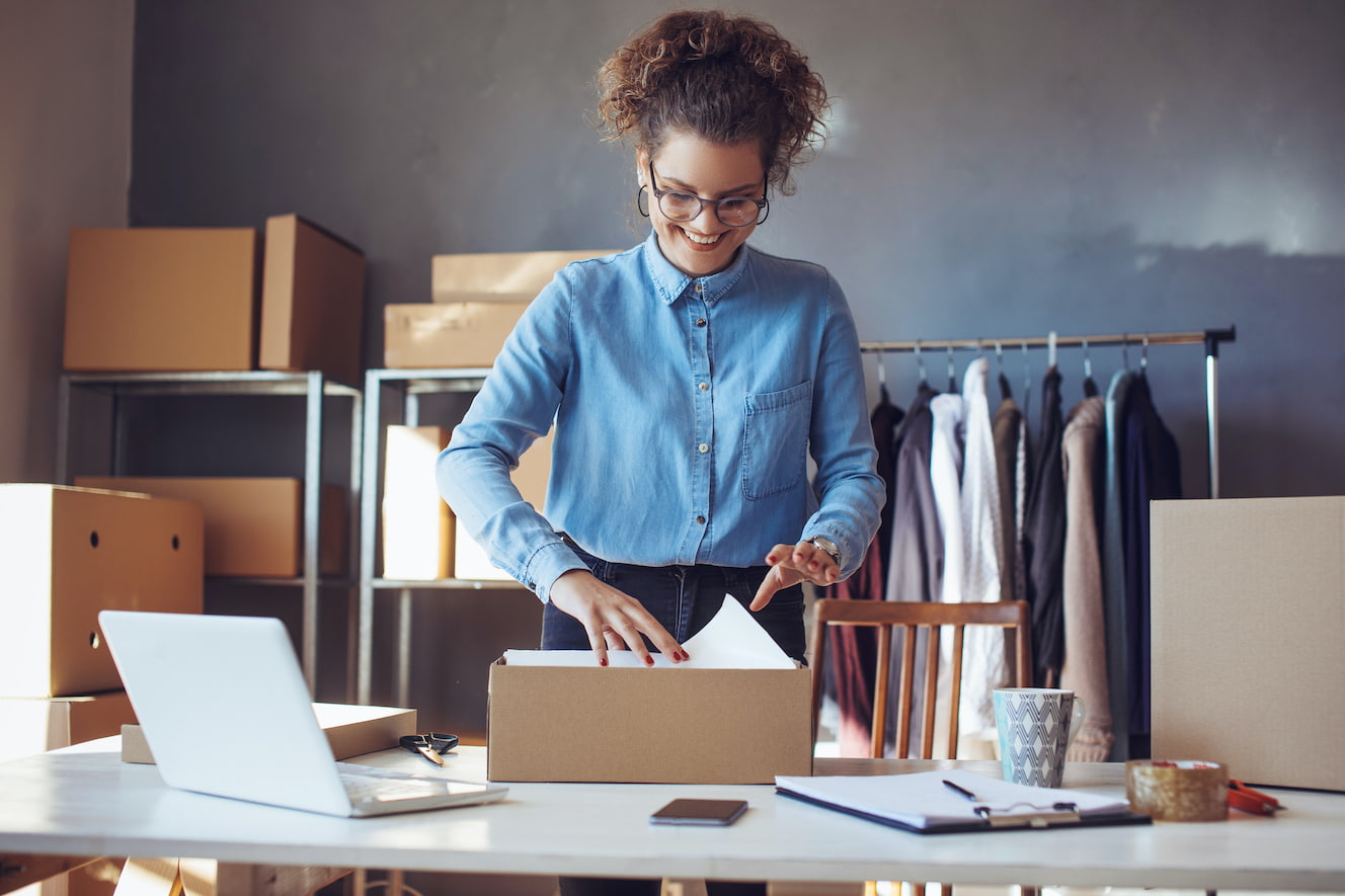 Woman packing a box for shipping