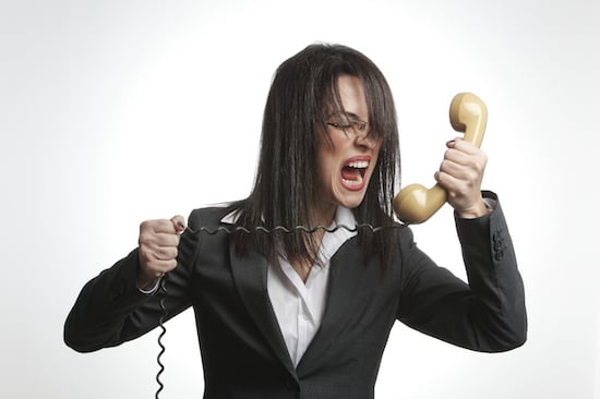 Woman yelling into telephone