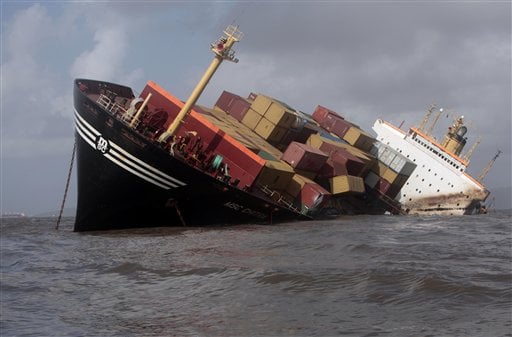 A sinking cargo ship holding shipping containers