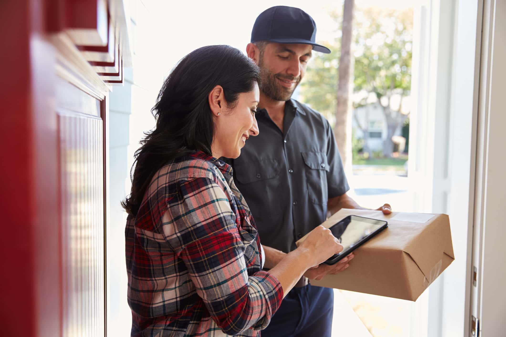 Woman signing for a package