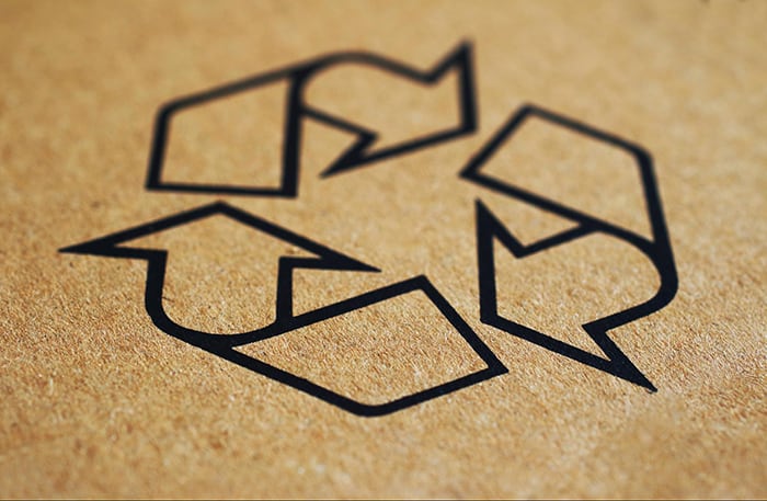 recycling logo on brown background