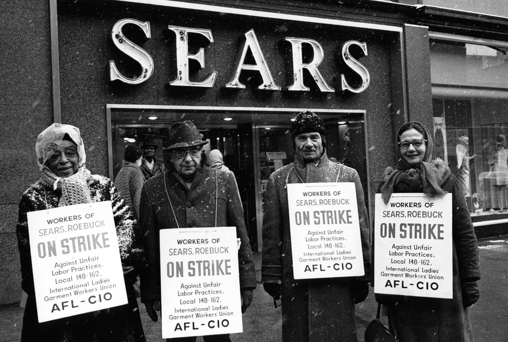 Striking worker standing outside of Sears