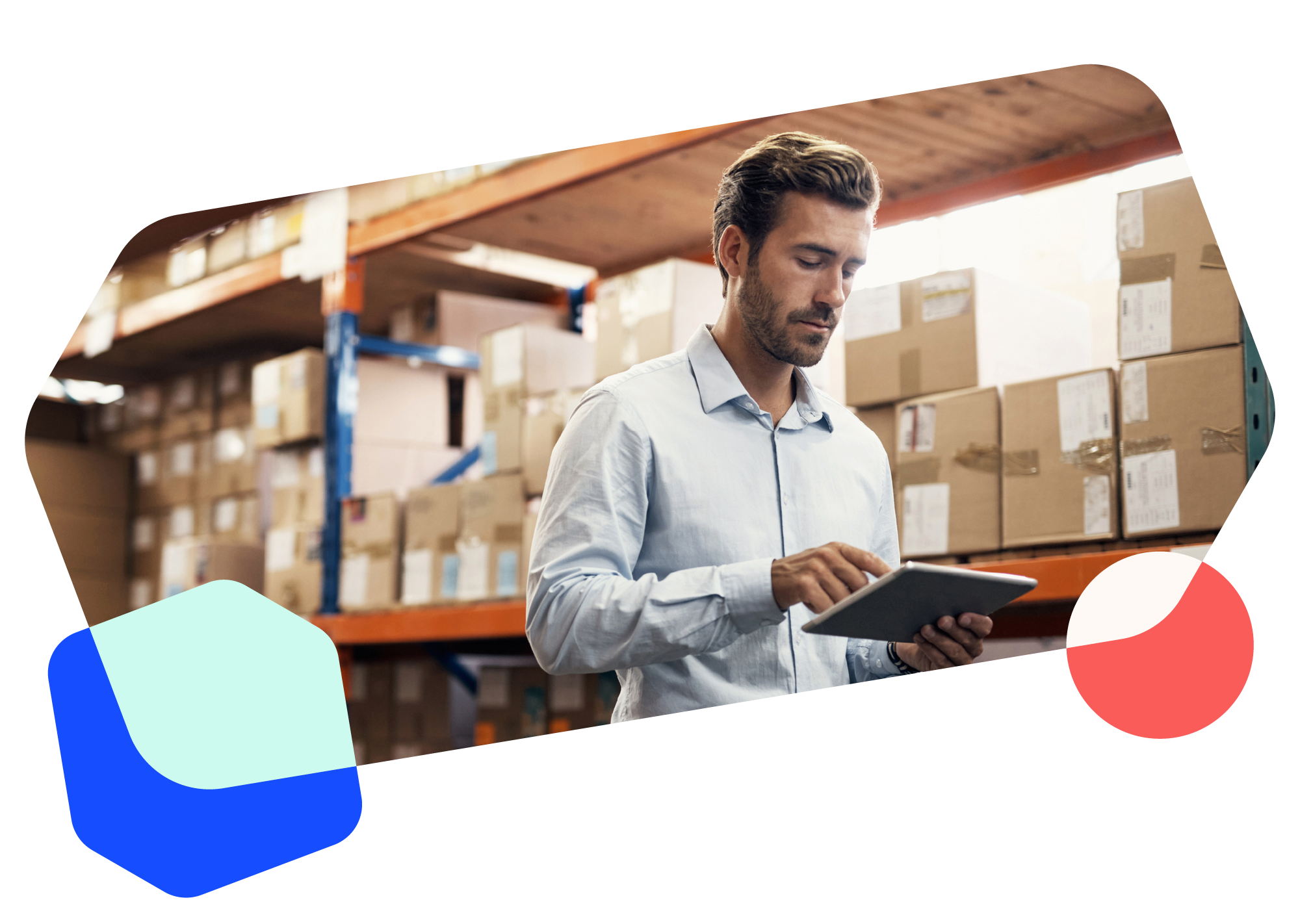 Warehouse workers smiling as they look at a tablet.