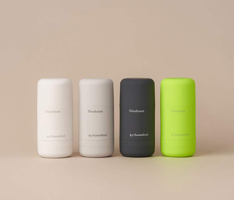Four refillable deodorant containers lined up next to each other.