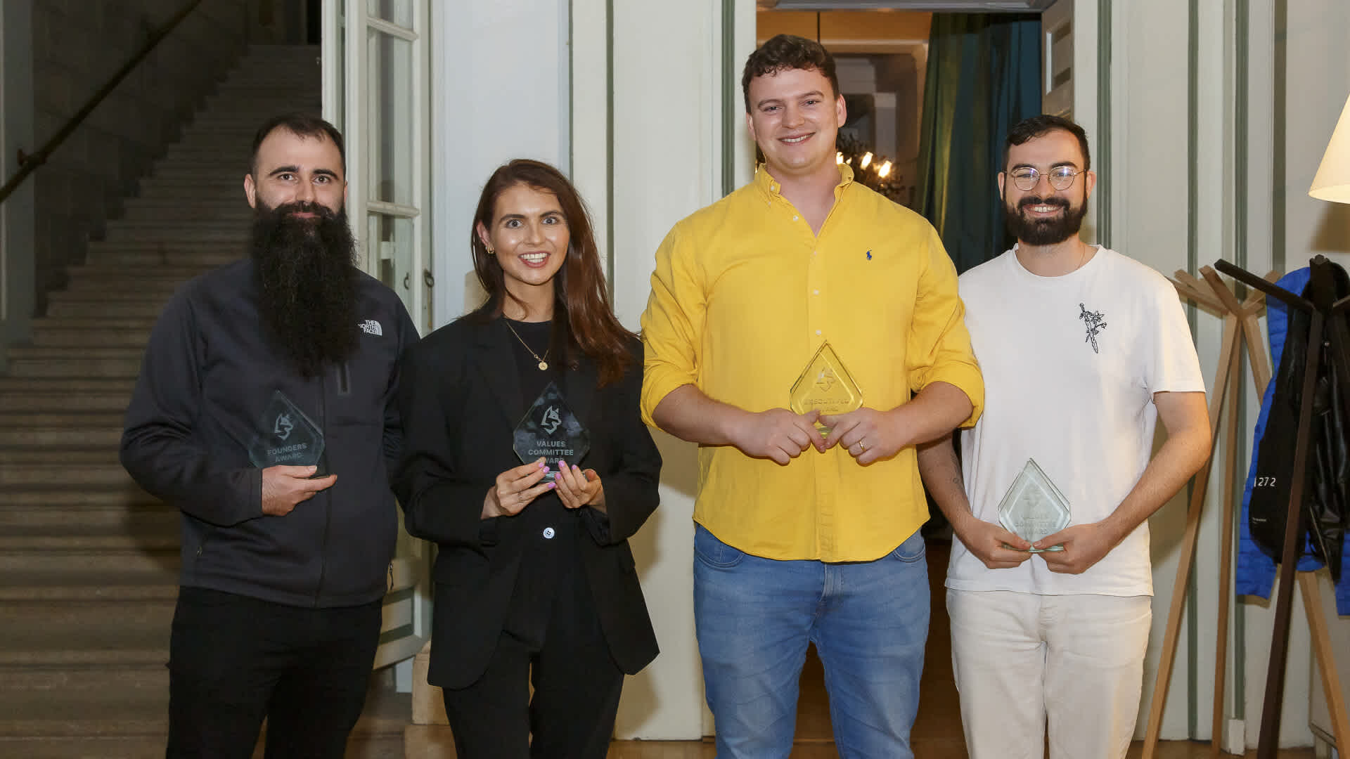 Roch, Aine, Freddie, and Steven show off their trophies