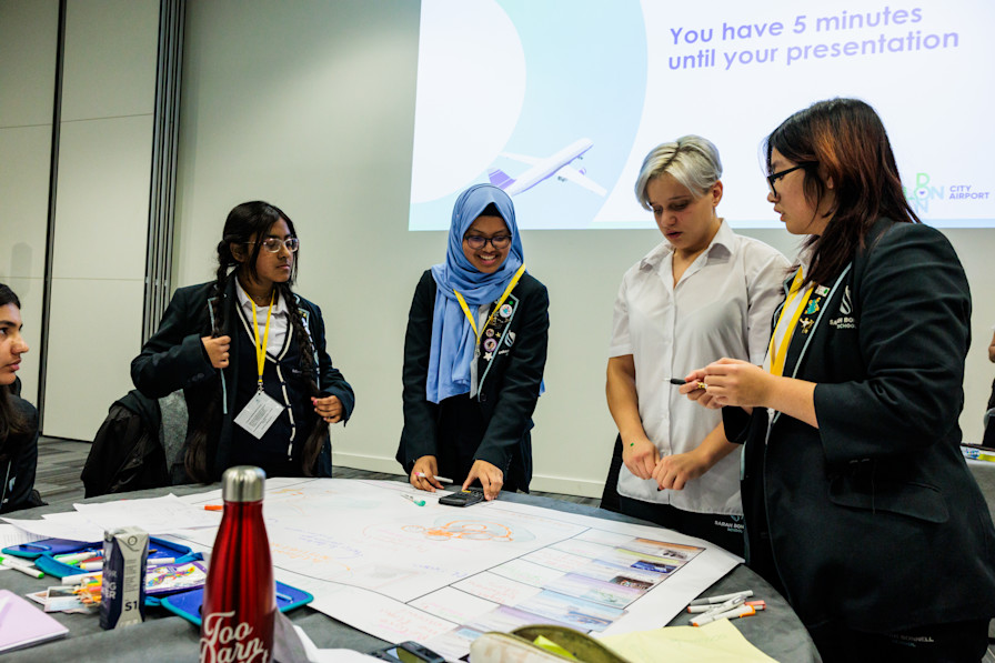 A group of students and teachers at the table