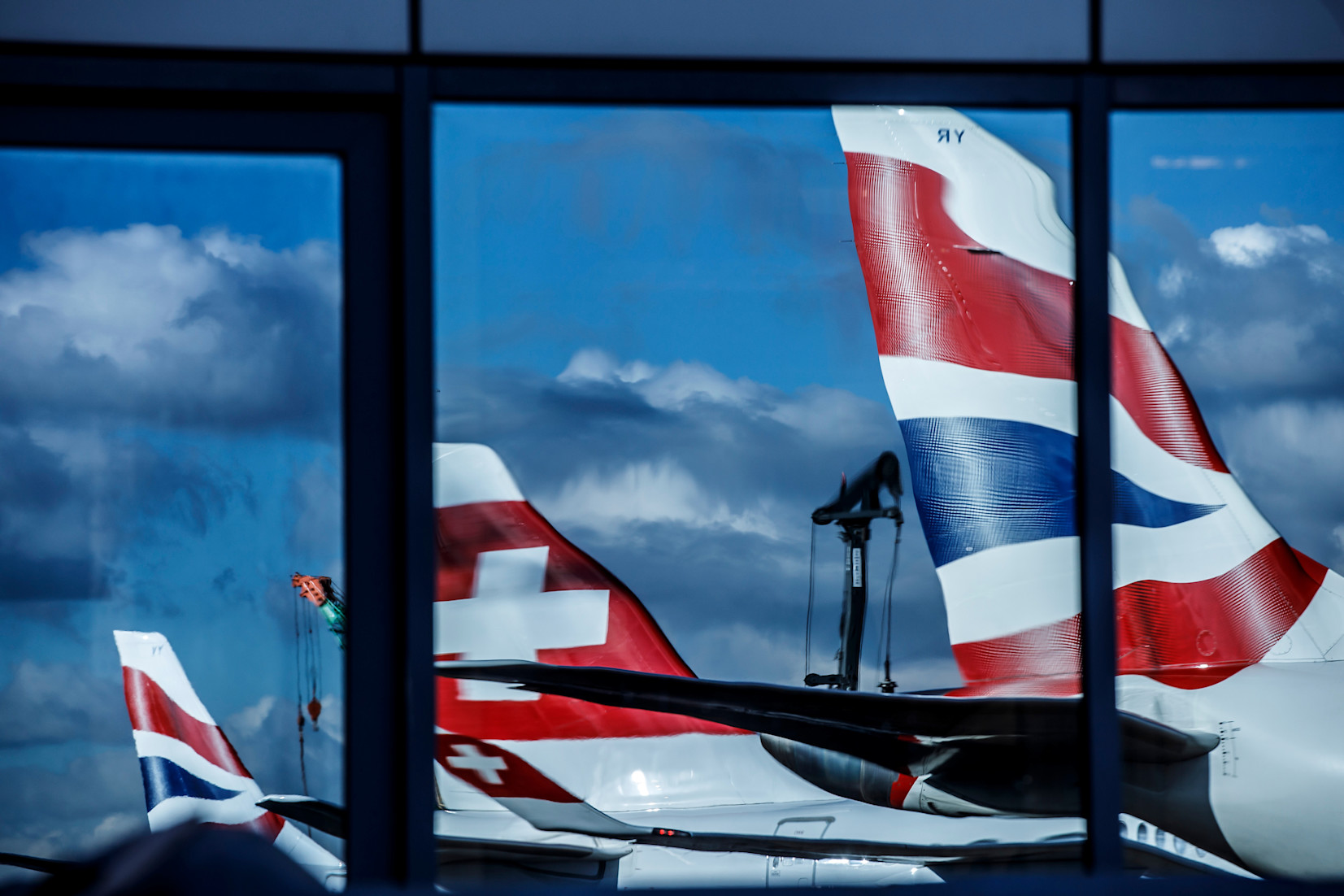 Plane tails through a window at LCY