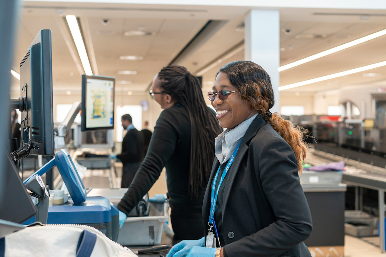 Two LCY employees at security