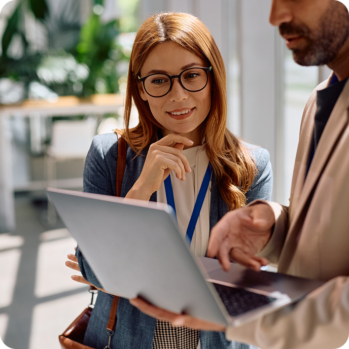 Coworkers collaborating in a bright office setting. Coworkers collaborating in a bright office setting.