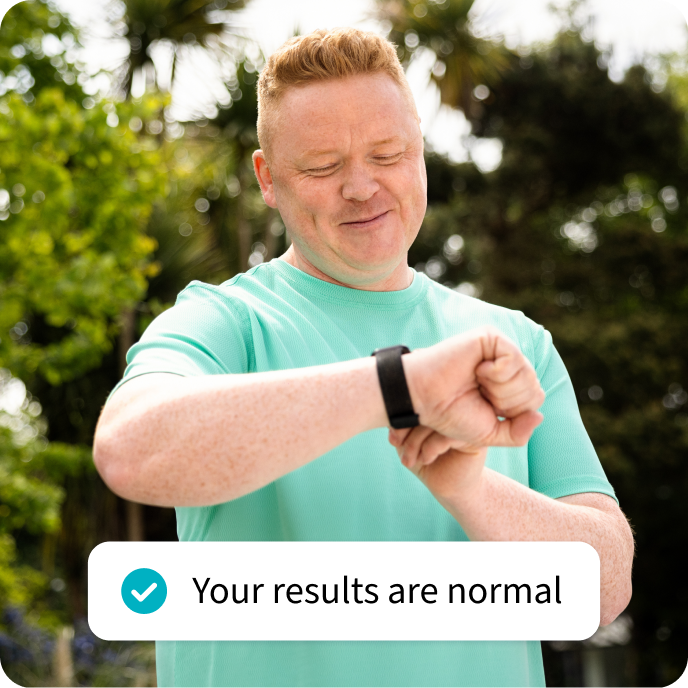 Man checking his smartwatch, next to a pop-up text that reads: "Your results are normal". Man checking his smartwatch, next to a pop-up text that reads: "Your results are normal".
