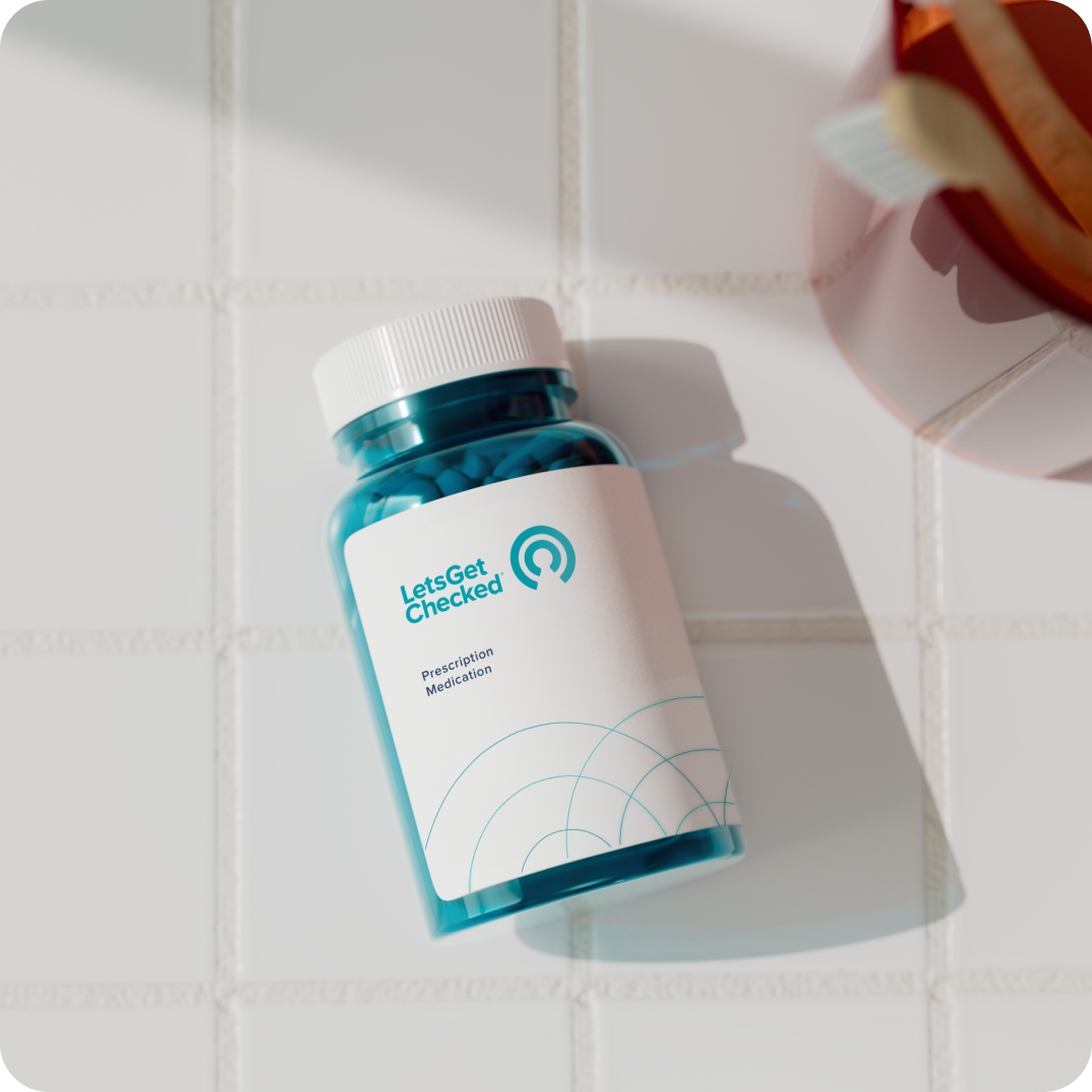 LetsGetChecked pill bottle on tiled surface.