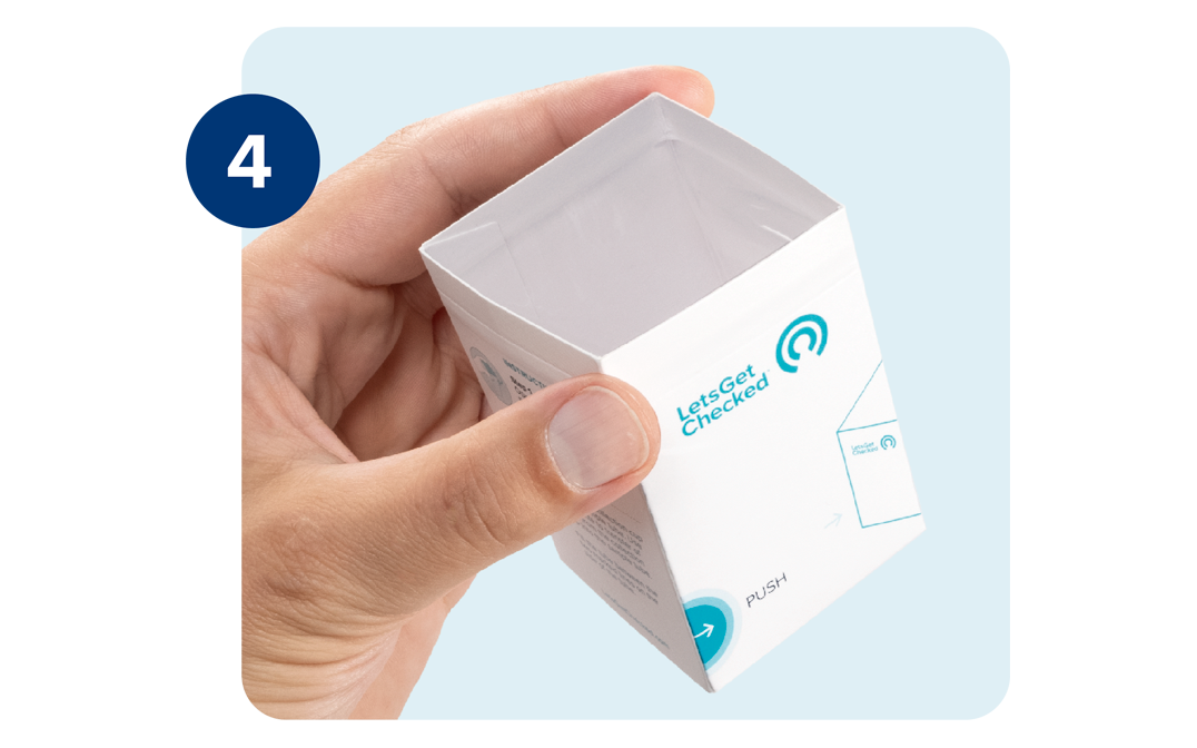 A left hand is shown holding an empty LetsGetChecked branded urine collection cup. A left hand is shown holding an empty LetsGetChecked branded urine collection cup.