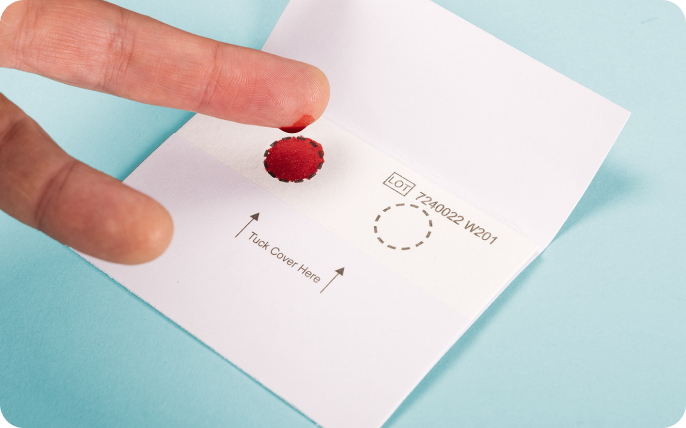 Close up of a dry blood sample collection method.