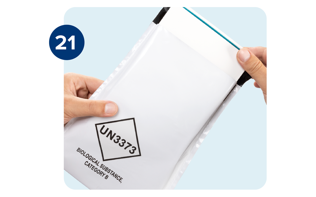 Kit box being placed inside the return envelope. Kit box being placed inside the return envelope.