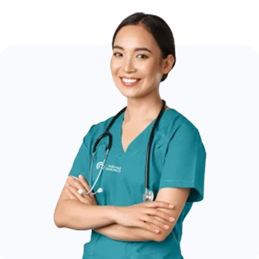 Healthcare provider smiling while wearing scrubs and a stethoscope.