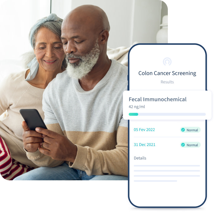 Older man and woman looking at colon cancer screening results on phone